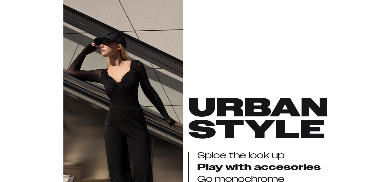 look w miejskim stylu - czarne spodnie, czarna bluzka i czapka z daszkiem