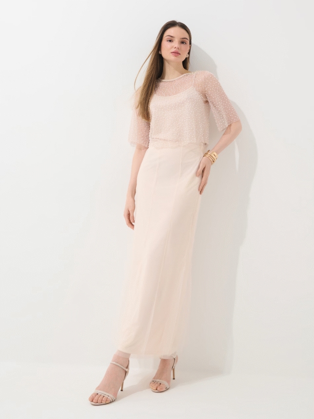 Stylizacja damska na wesele od MOHITO. Spódnica beżowa midi, delikatna w połączeniu z ozdobną bluzką. Spódnica o kroju litery A i długości midi, z wysokim stanem.