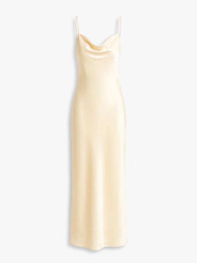 Satynowa sukienka w żółtym kolorze na cienkich ramiączkach. Sukienka długość maxi posiada wiązanie z tyłu. Sukienka na wesele 2026.