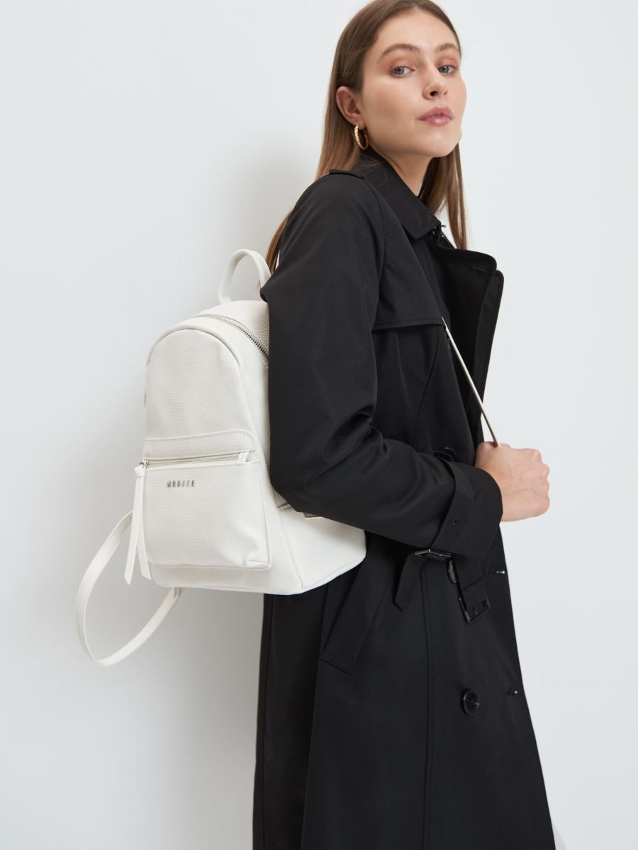 white faux leather backpack