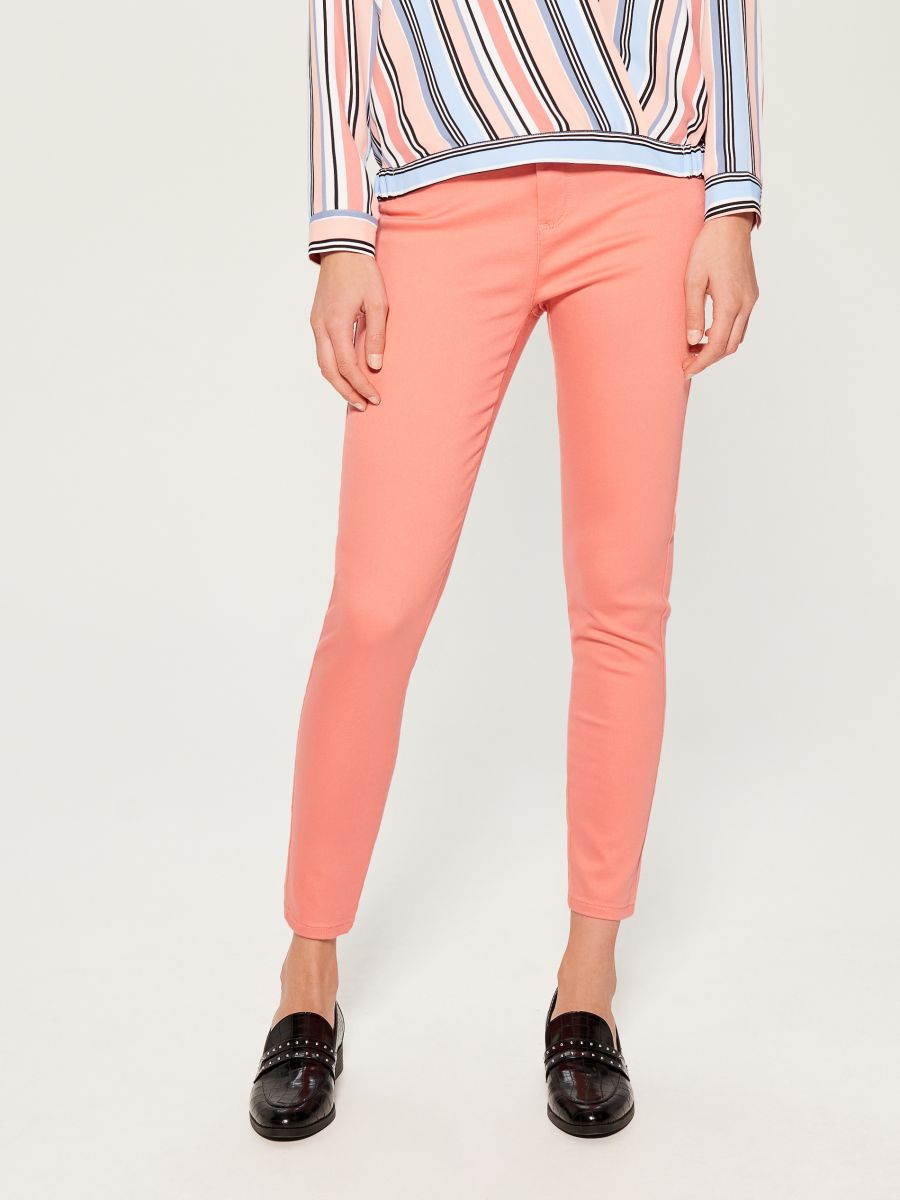 orange skinny trousers